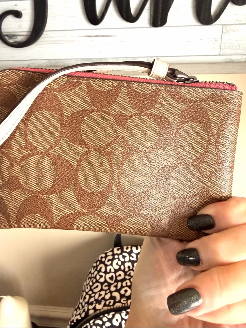 Coach Brown Signature Wristlet with Pink Lip Print near new
